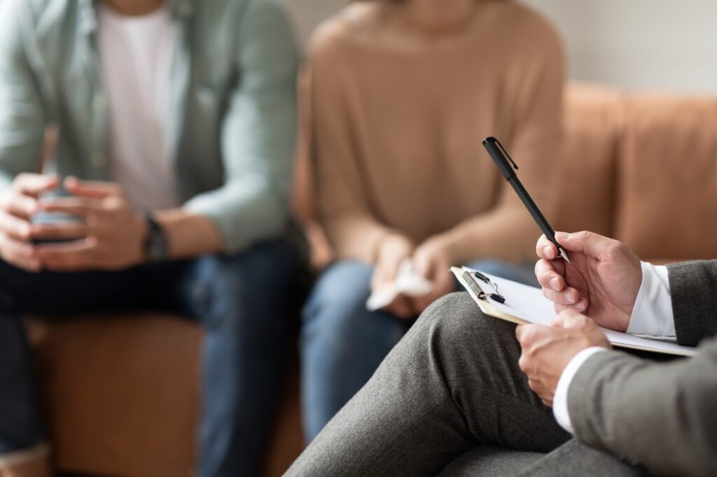 Couple having therapy session with male professional